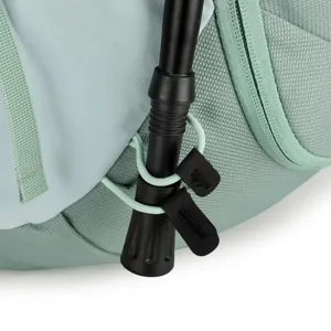 Durable hiking backpack detail showing trekking pole attachment system with waterproof fabric.