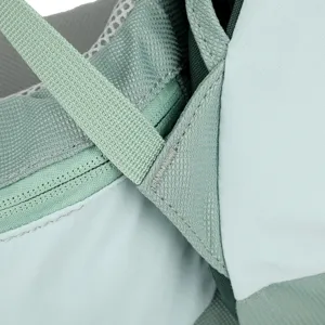 Close-up detail of outdoor backpack strap and mesh stitching, showing durable nylon quality.