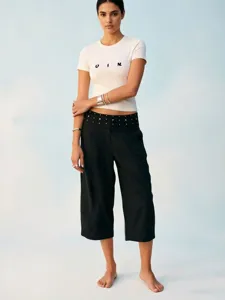 Cross-border fashion casual outfit featuring a white t-shirt and black rolled-waist rhinestone pants.