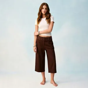 Women's brown cropped wide-leg trousers featuring rhinestone studded folded waistband style.