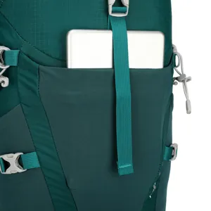 Close-up detail of outdoor backpack front pocket, durable green fabric with adjustable straps.