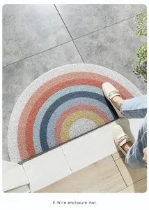 Detail view of the half-circle rainbow silk loop door mat showing anti-slip texture.