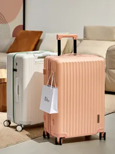 Large capacity trolley suitcase set with vertical stripes, durable travel luggage for women and men.
