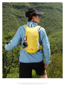 Detailed view of lightweight outdoor hiking backpack in yellow color with trekking poles.