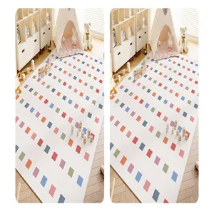 Detailed view of colorful square pattern crawling mat for kids room, cozy home decor rug.