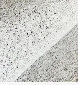 Detailed view of white PVC noodle mat texture, showing flexible loop and non-slip surface.