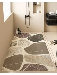 Modern minimalist bathroom floor mat detail showcasing the pebble pattern loop drainage.