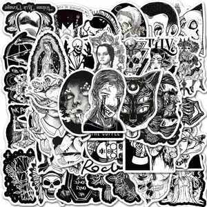 Détail de stickers graffiti gothique punk noir et blanc avec têtes de mort et motifs.
