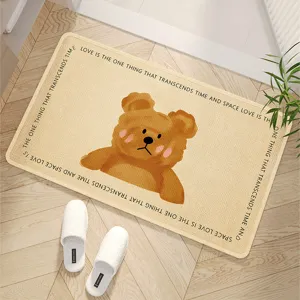 Close-up of the cute cartoon bear bath mat detail with cozy beige design and soft texture.