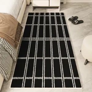 Modern black and white grid carpet for bedroom, soft minimalist floor mat for home decor.