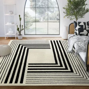Modern geometric black and white area rug for living room bedroom minimalist floor decor detail.