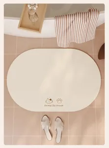 Tappetino da bagno ovale beige antiscivolo in terra diatomacea con grazioso motivo gatto