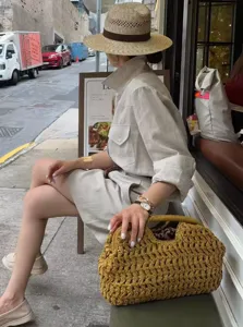 Stylish paper straw woven clutch bag for women, perfect for casual beach vacation and daily use.