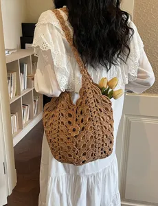 Chic hollow crochet shoulder bag for women, stylish knitted straw hobo bag for casual daily wear.