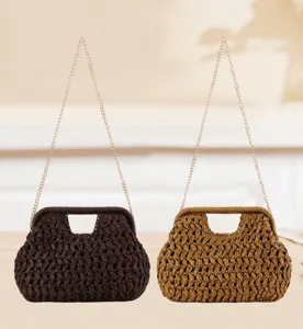 Detail view of the retro woven straw handbag with delicate chain strap, perfect for summer beach style.