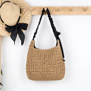 Woven straw shoulder bag with black pleated strap, casual beach handbag for women daily use.
