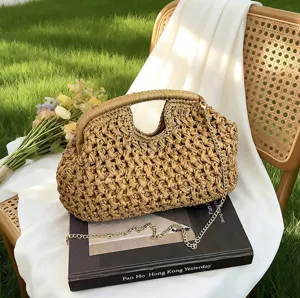 Woven straw clutch bag with metal chain, vintage shell design, perfect for beach and summer casual wear.