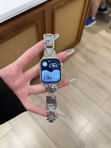 Metal strap for Apple Watch with cute puppy design and colorful rhinestones, stylish accessory.