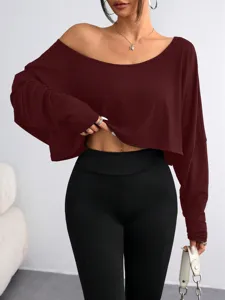 Burgundy off-the-shoulder long sleeve crop top detail view showing stylish fit and soft fabric.