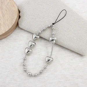 Silver heart beaded phone charm detail shot, metal love beads strap for mobile and bags.