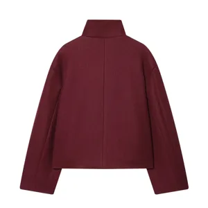 Back detail of minimalist high neck short woolen coat in burgundy, stylish and cozy women apparel.