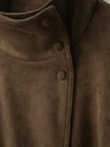 Close-up detail shot of the brown faux suede jacket collar, showcasing fine texture and buttons.