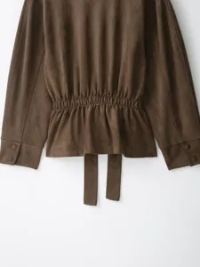 Brown suede jacket back detail, women's retro stylish outerwear with cinched waist and tie belt.