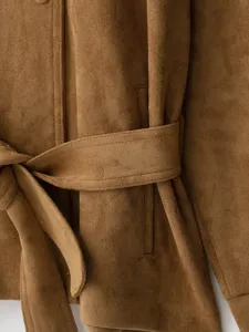 Brown faux suede jacket detail showing the matching waist belt and soft textured fabric.