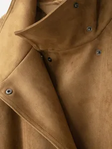 Brown suede jacket detail showing collar lapel and metal snap buttons for women autumn style.