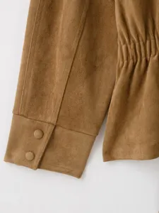 Brown faux suede jacket sleeve cuff and gathered waist detail close up display view
