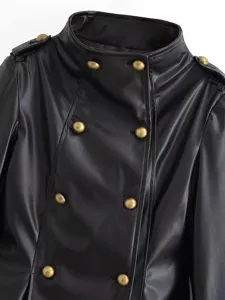 Close-up detail shot of a black faux leather jacket featuring a stand collar and gold buttons.