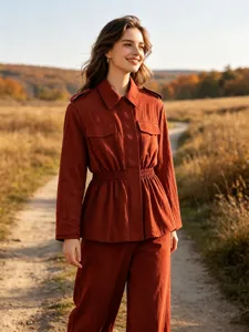 Detail view of stylish casual solid color two-piece outfit worn outdoors on a scenic path.