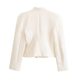 Back view detail of the elegant cream mandarin collar cropped blazer with tailored paneling.
