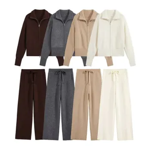 Women's solid color half-zip knit cardigan and stylish wide leg pants loungewear set.