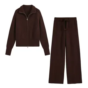 Detailed view of the dark brown knitted set featuring a zippered cardigan and wide-leg trousers.