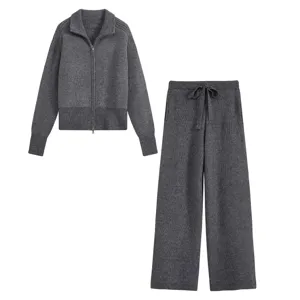 Dark grey knitted tracksuit set detail, zip-up cardigan and wide-leg trousers design.