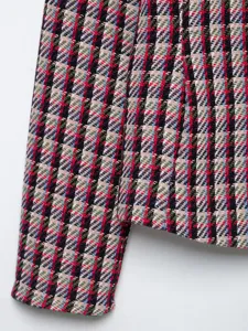 Tweed blazer sleeve detail shot showcasing the multi-color textured woven fabric design.