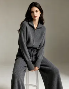 Detailed view of a women's dark grey knit two-piece set featuring zipper cardigan and pants.