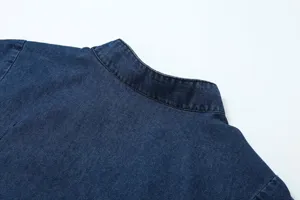 Close-up detail of the dark blue denim collar, showing fine stitching and classic style.