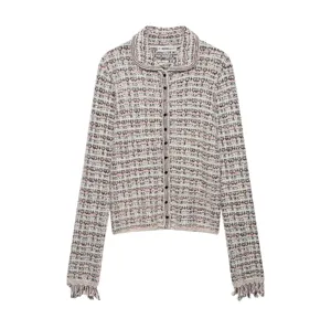 Detailed view of the tweed knit cardigan with lapel collar, buttons, and fringed cuffs.