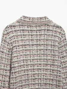 Detail shot of women multi-color tweed knit cardigan collar, premium textured fabric.