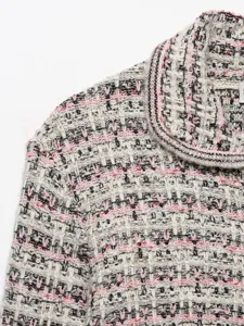 Detail shot of women's autumn lapel mixed color tweed knit cardigan fashion style.
