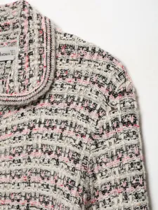 Women's tweed lapel knitted cardigan detail, multicolored houndstooth woven textured outerwear top.