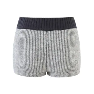 Detailed view of women high waist knitted shorts in grey and black. Cozy ribbed knit design.