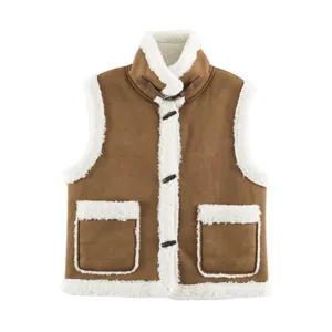 Close-up detail of women brown fleece vest with sherpa patchwork and cute toggle buttons.