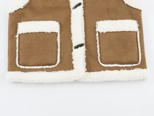 Close-up of brown faux suede lamb wool patchwork vest with horn buttons and pockets.