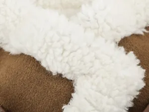 Brown suede and white sherpa fleece fabric detail view of winter women vest jacket.