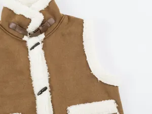 Detail shot of brown shearling vest showing lapel collar, toggle buttons and faux suede fabric.