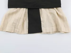 Detail view of the new Chinese style contrast color top, featuring stylish striped fabric.