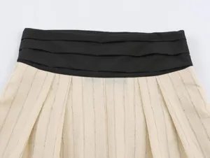 Detail shot of women's contrast waistband wide leg pants or skirt with pinstripe fabric.